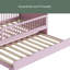 Lit plateforme en bois avec garde-corps et lit gigogne-640738093
