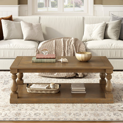 Table basse U_STYLE avec pieds en colonne de style artistique et placage de pin luxueux pour un charme intemporel, convenant au salon et à la salle d'étude
