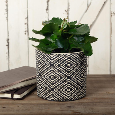 Boîte à fleurs noire et crème avec motif aztèque