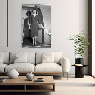1960s SMILING STEWARDESS STANDING IN DOORWAY OF AIRPLANE LOOKING AT CAMERA by H. Armstrong Roberts - Wrapped Canvas Print