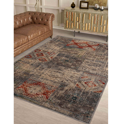 Nanaakua 100% Polypropylene Modern Distressed Patchwork Indoor Area Rug