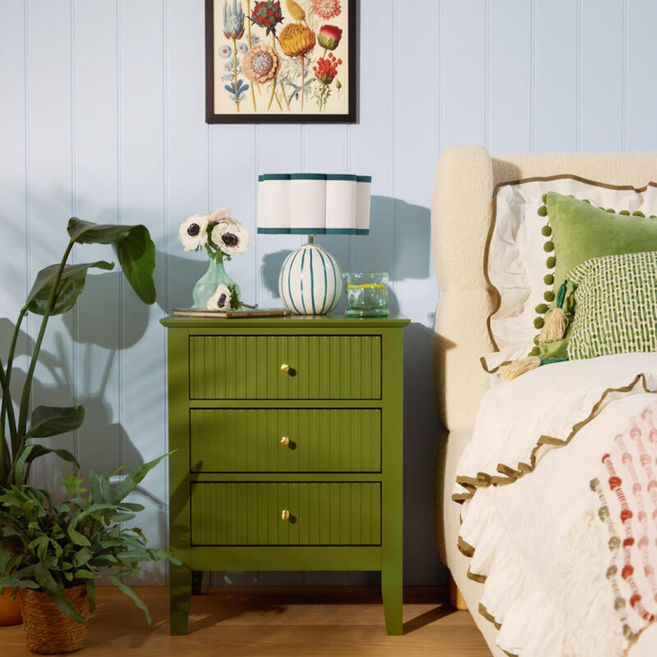 Brown wooden dresser with three drawers.