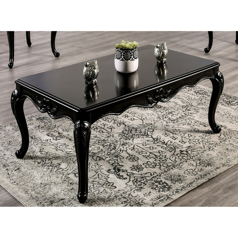 Table basse de style traditionnel avec pieds incurvés en bois massif