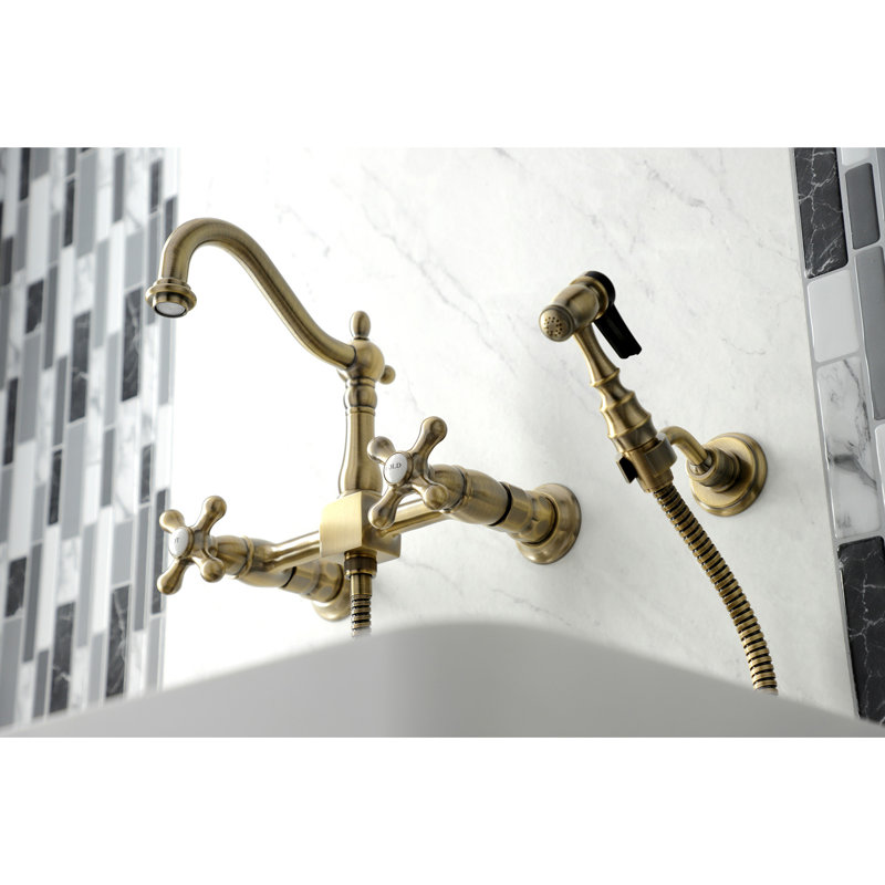 Kingston Brass Heritage Double-Handle 3-Hole Wall-Mount Bridge Kitchen Faucet with Brass Sprayer, Antique Brass