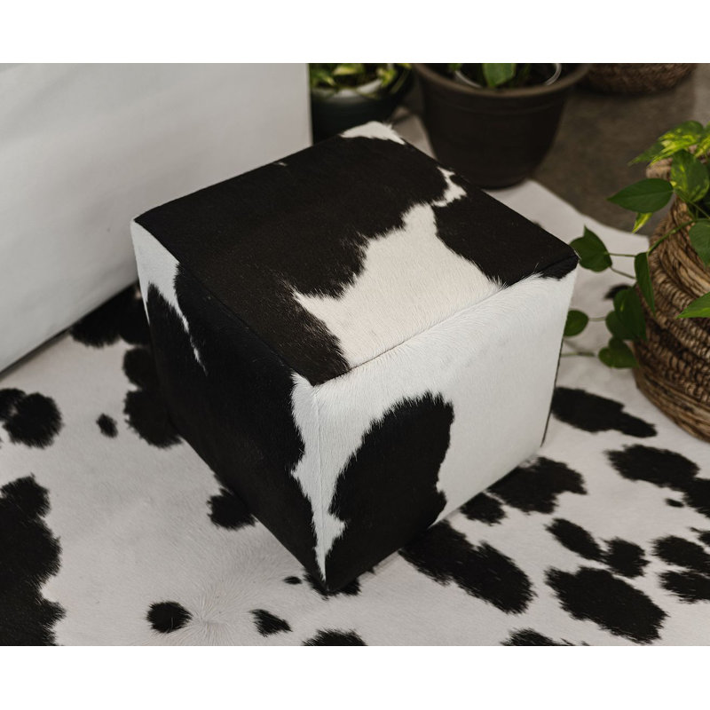 Repose-pieds en cuir de vache - pouf décoratif noir et blanc