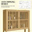 Armoire de rangement en bambou au-dessus de la toilette avec portes à lattes et tablette réglable