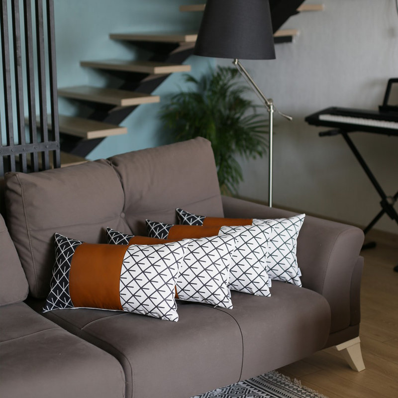 Ensemble de 4 housses de coussin lombaire en similicuir noir et blanc