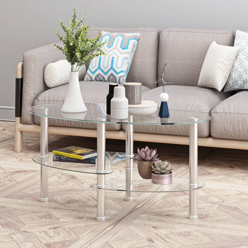 Table basse ovale avec plateau en verre et tablette