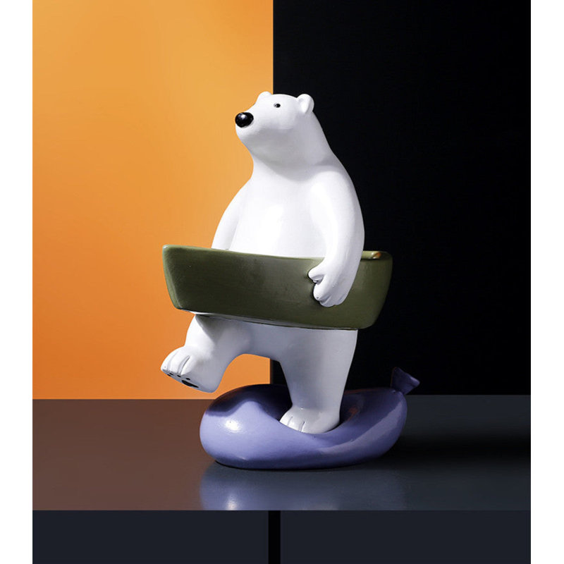 Adorable statue d'ours avec un bateau vert