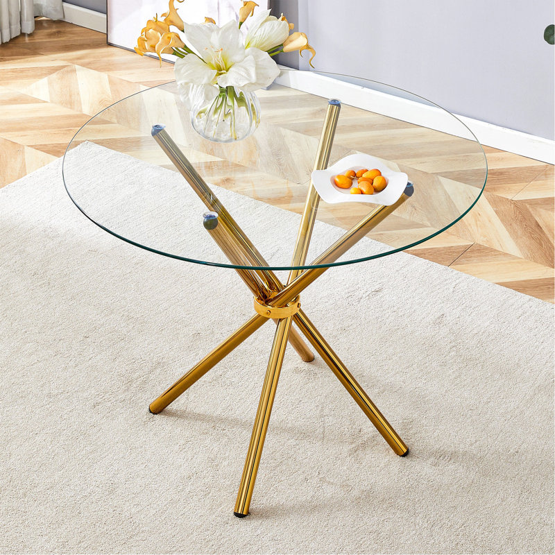 Table de salle à manger ronde en verre transparent avec une forme unique pour 4 à 6 personnes, avec des pieds en métal doré rassemblés en forme d'anneau, convenant aux bureaux, aux cuisines, aux terrasses et aux salles à manger.