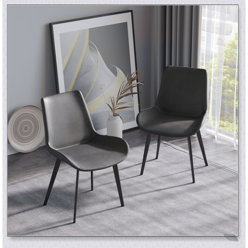 Chaise de salle à manger moderne avec dossier ergonomique et pieds élégants en métal noir pour une assise confortable