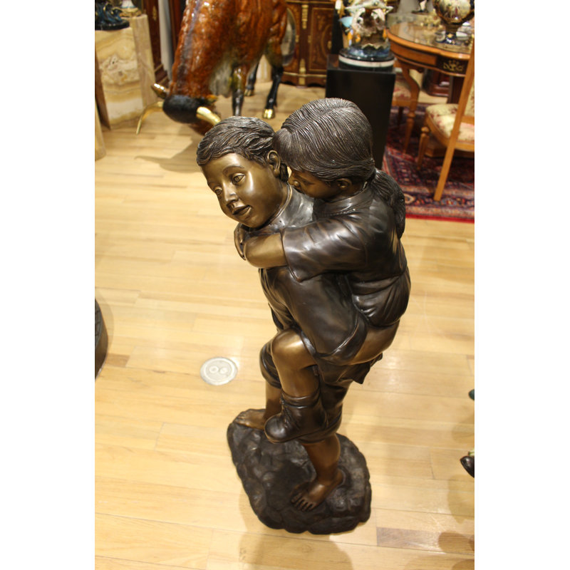 Boy Giving Girl Piggyback Ride Statue