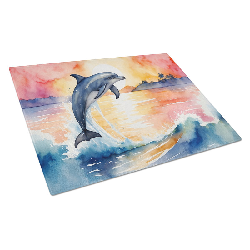 Planche à découper en verre avec dauphin sautant au lever du soleil
