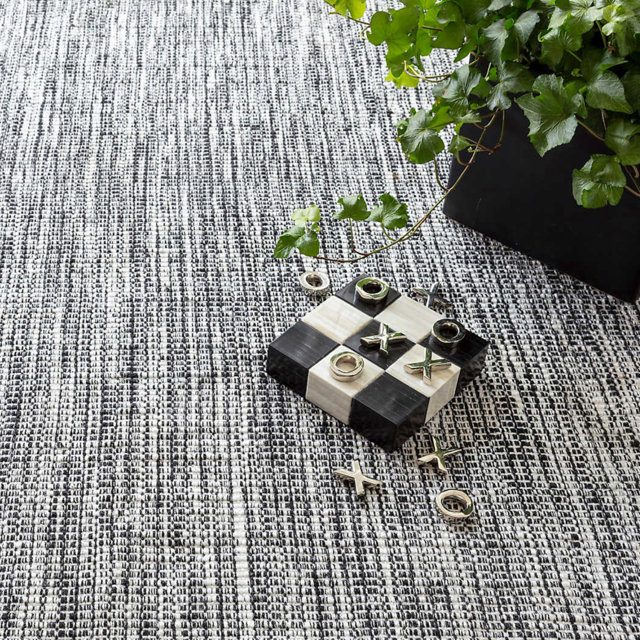 Black and white rug with tic-tac-toe game