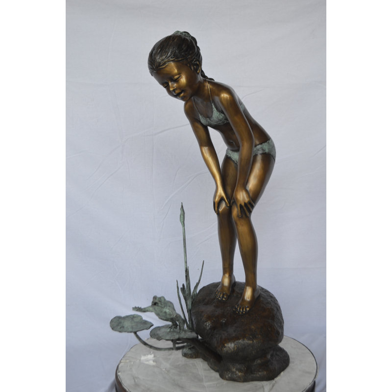 Copper and Metal Girl looking at frog jumping bronze fountain -  Size: 21"L x 15"W x 38"H.