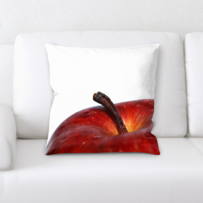 Coussin décoratif "betancourt fruits" près d’un coussin décoratif blanc sur fond