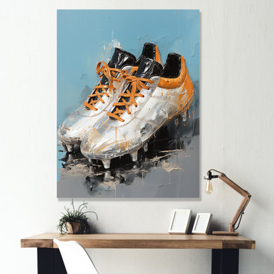 Chaussures de soccer grises et oranges