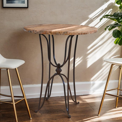 Desert Scroll 41" Round Stone Top Accent Table with Curved Iron Base