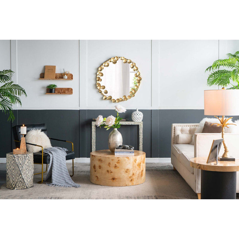 Miroir mural rond en métal avec détails dorés