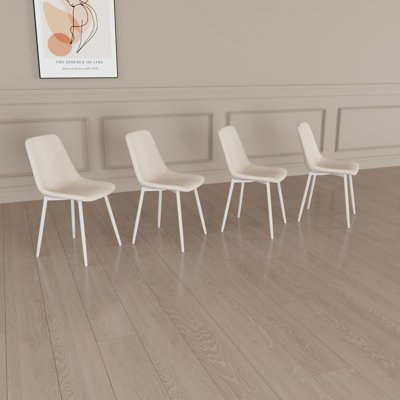 De 4 chaises de salle à manger en lin beige, fabriquées en métal, convenant à différents styles de chaises modernes en lin, avec structure et créant un environnement confortable