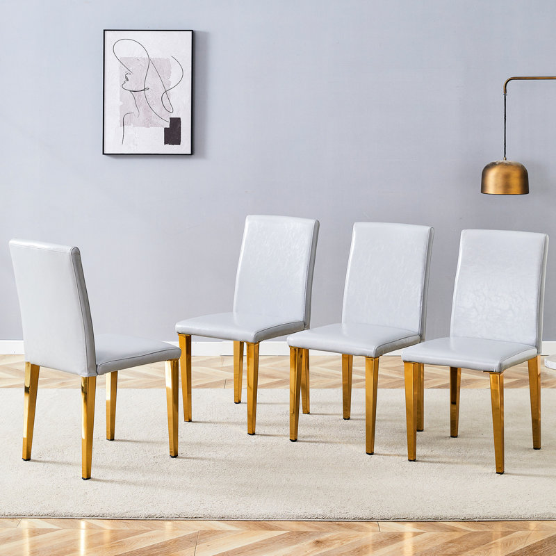 Quatre sièges de salle à manger en polyuréthane gris - confortables et élégants, avec structure en métal de 4 chaises au design glissant