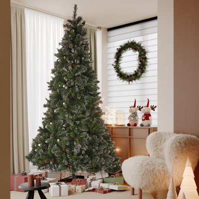 Arbre de Noël à poils scintillants avec baies rouges et pommes de pin