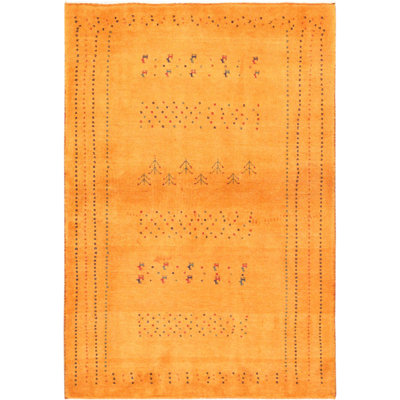 Nogosek Area Rug in Gold