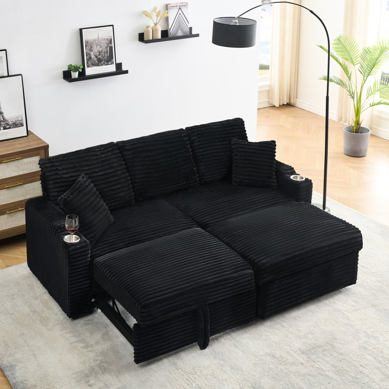 Chaise longue pliable cachée en velours côtelé noir avec porte-gobelet, repose-pieds et rangement pour un appartement moderne vivant au calme