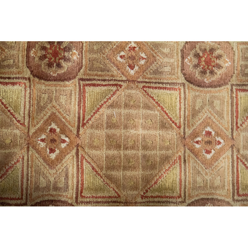 Tapis doré de haute qualité noué à la main