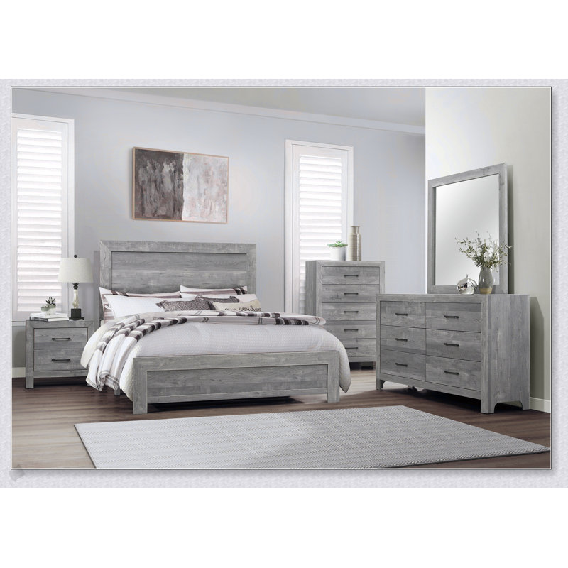 Commode rustique à finition grise avec cinq tiroirs de rangement et quincaillerie en métal noir pour l'organisation de la chambre à coucher