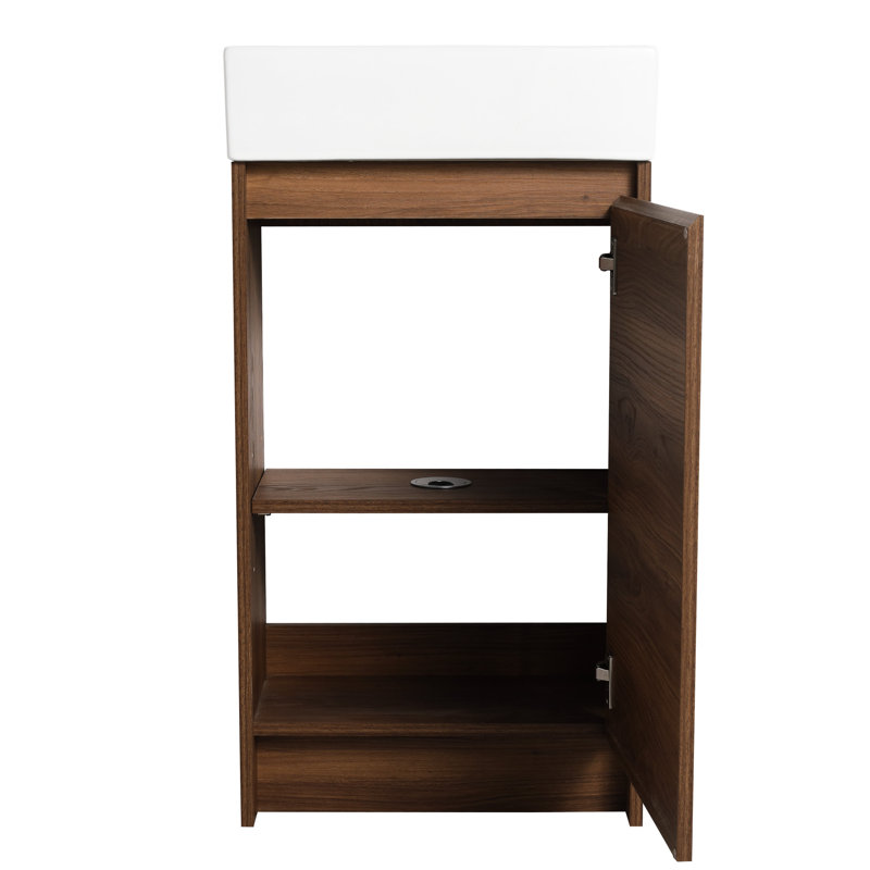 Meuble-lavabo autoportant de 18 pouces avec lavabo simple. Portes d'armoire à fermeture silencieuse. Bassin en céramique fiable. Contreplaqué brun ébène pour les salles de bain compactes 18 "au toucher élégant. Salle de bain
