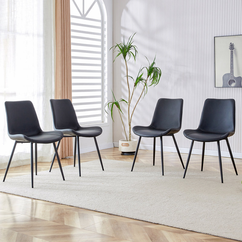 Ensemble de chaises de salle à manger en polyuréthane à coussin de siège allongé - quatre pièces. Conception aux lignes épurées. Peut s'intégrer à divers styles de décoration moderne.