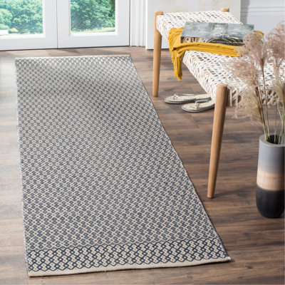 Tapis ivoire / bleu marine en coton tissé à plat à la main Bester
