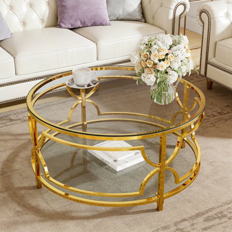 Table basse ronde avec plateau en verre trempé, structure en métal géométrique et tablette inférieure, Transparent