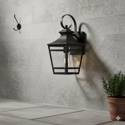 Une grande applique murale d'extérieur mesurant 16,5 pouces, avec une conception murale, une finition noire imperméable et des panneaux de verre transparent. Convient aux patios, aux couloirs et aux garages (unité simple).