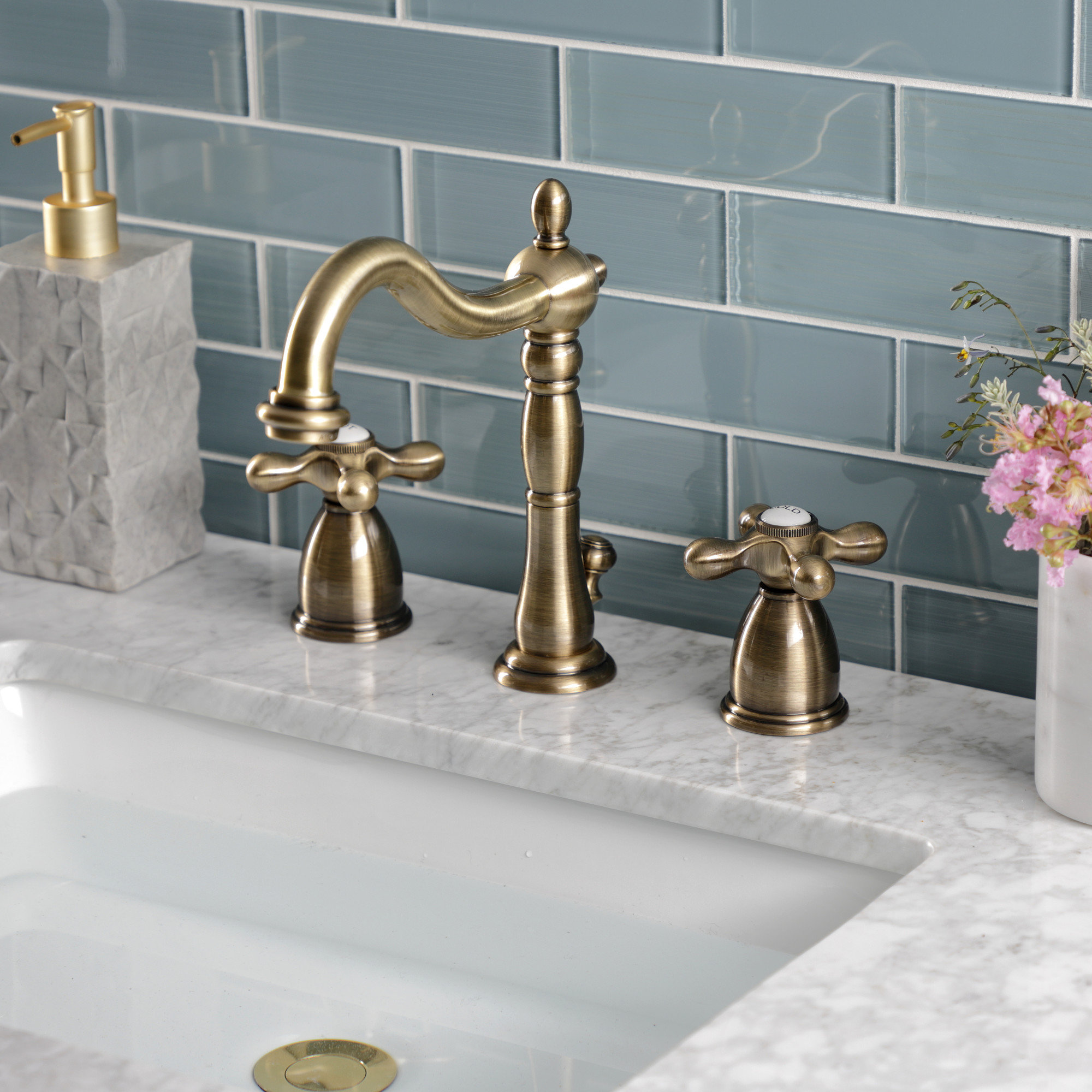Kingston Brass Heritage Two-Handle 3-Hole Deck Mount Widespread Bathroom Faucet with Pop-Up Drain, Vintage Brass