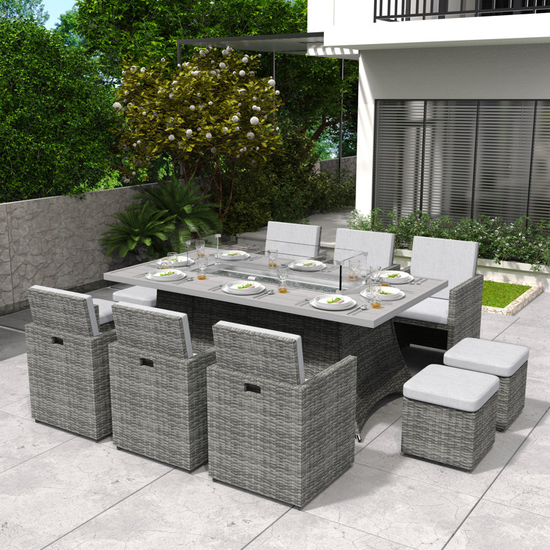 Bentlei 10 - Person Wicker Patio Dining Set with Rectangular Table , Cushions Included