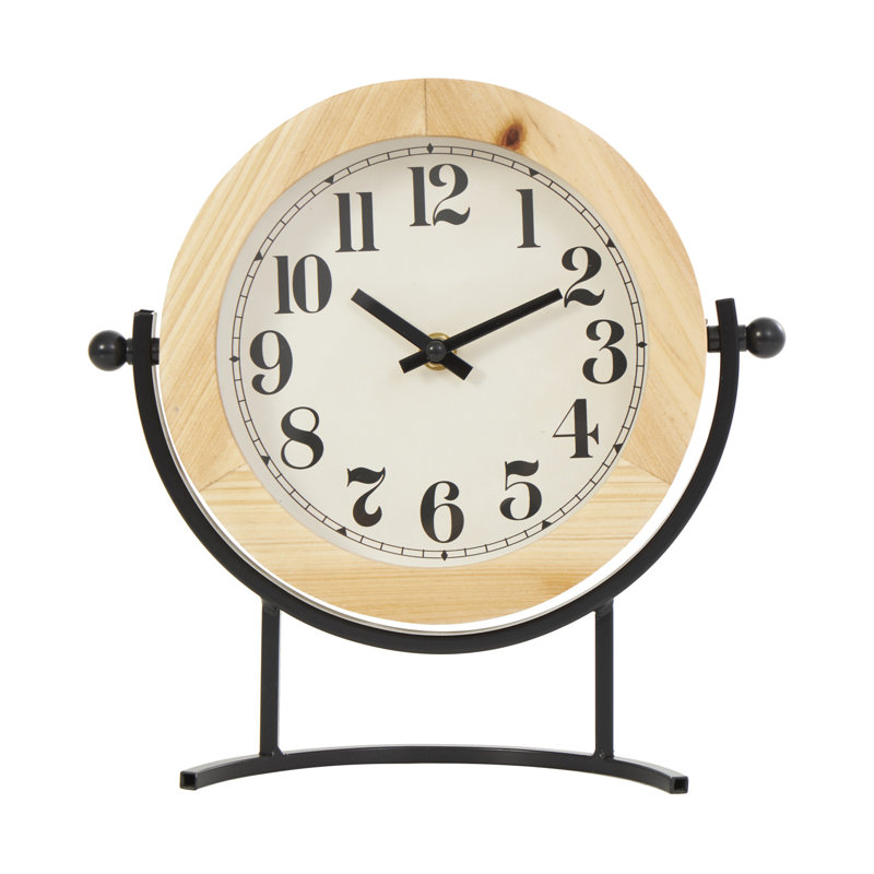 Horloge décorative en bois brun clair avec support en métal noir incurvé et détails de boule