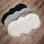 Tapis noir en fausse fourrure-77438961