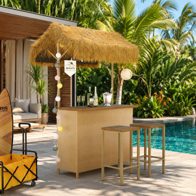Ensemble de patio à hauteur de bar de style hawaïen avec auvent et tabourets