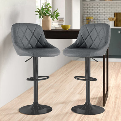 Mbagaya Swivel Upholstered Counter Stool