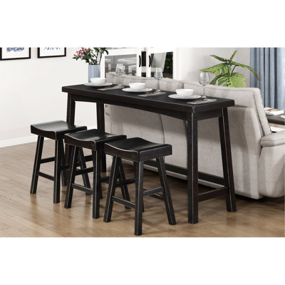 Table haute et tabourets en bois massif noir pour salle à manger élégante de style transitionnel.