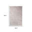 Tapis beige à poils longs résistant aux taches