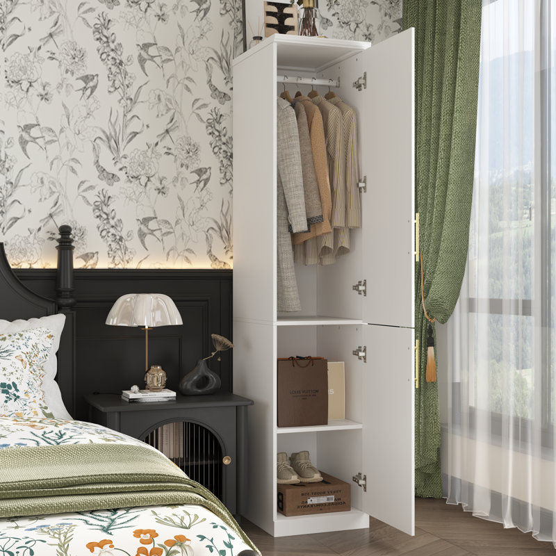 Armoire compacte blanche avec deux portes, conception peu encombrante avec poignées dorées et plusieurs sections de rangement