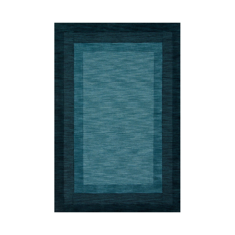 Tapis en polypropylène à motif géométrique de couleur turquoise et bleu marine à motif géométrique