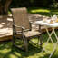 Fauteuil à bascule d'extérieur Outsunny, avec structure en acier et tissu en maille, idéal pour terrasse, jardin et véranda, couleur brun clair.