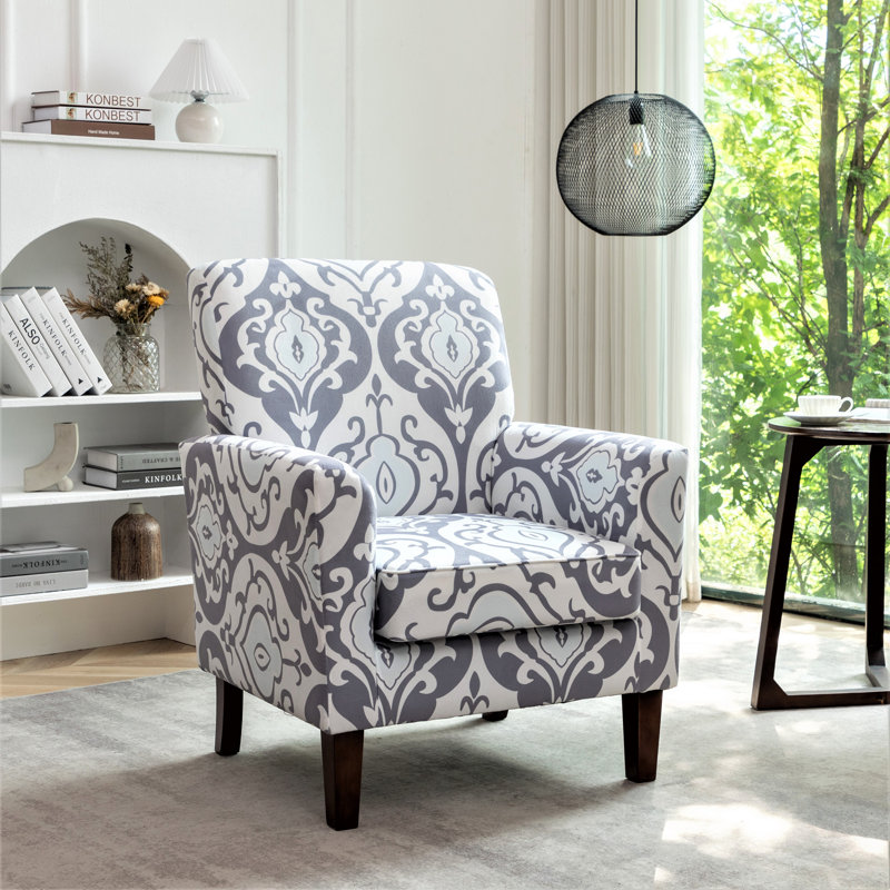 Fauteuil à motifs en mélange de polyester avec structure en bois de bouleau massif, pieds fuselés bruns et siège rembourré en mousse pour le salon ou le bureau