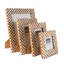 Cadre photo motif os et bois à carreaux-111745181