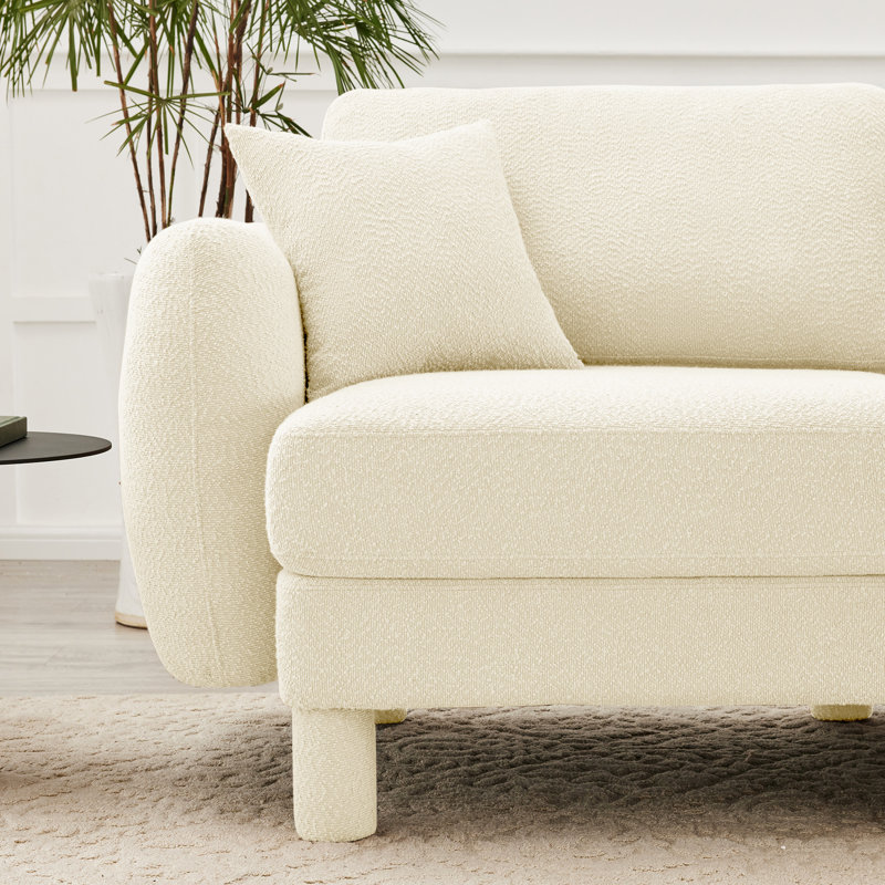 Canapé modulaire en U à 4 places avec boucle beige, pieds cylindriques, coussins de siège moelleux et tissu bouclé de style contemporain avec assise en forme de coquillage, expérience de détente