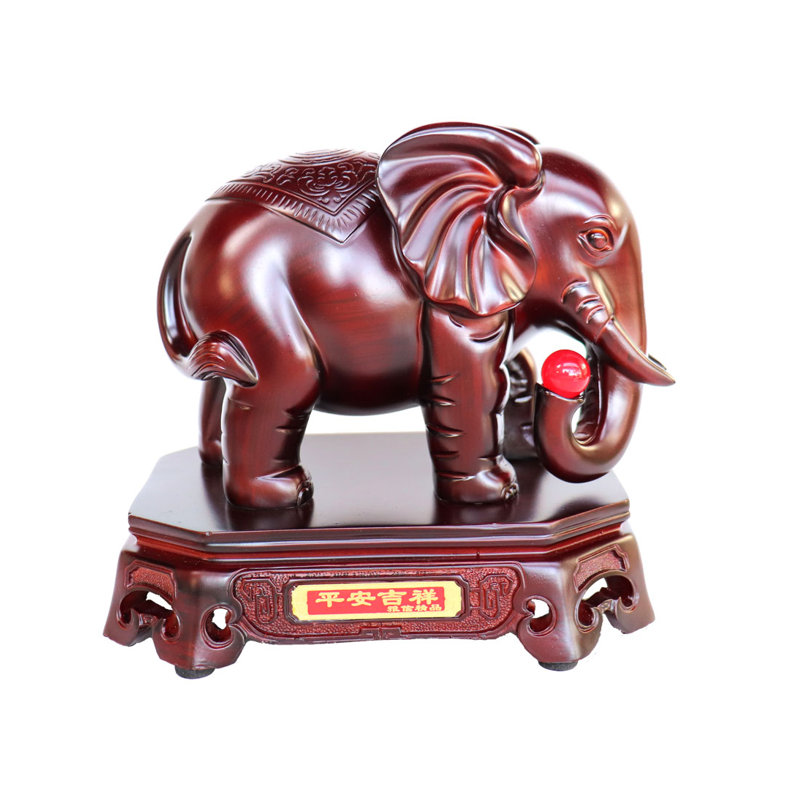 Figurine éléphant Feng Shui tenant un bijou avec tronc